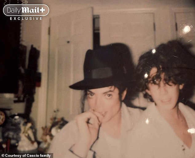 A polaroid shot shared with the Daily Mail shows Edward Cascio posing with the singer – who is in his famous black fedora – at the Cascio family home in Franklin Lakes, New Jersey