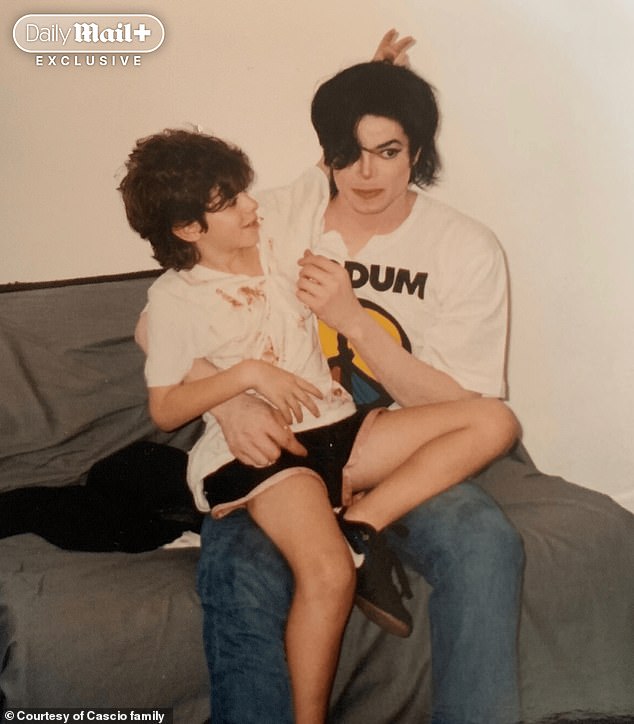 In another disturbing image, Dominic is seen sitting on Jackson during a 1996 trip to Brazil – the now 45-year-old says looking back at the image is 'haunting'