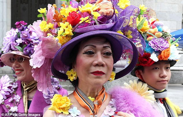 Others donned colorful hats and bonnets covered in flowers and frills - or even colorful eggs perched on top of a few heads