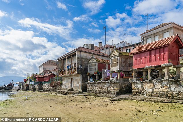 Combarro is known for its 60 stone hórreos (pictured) that can be found along the shoreline and are best seen during low tides. They are raised structures that were built for holding grain and other food items in the Middle Ages