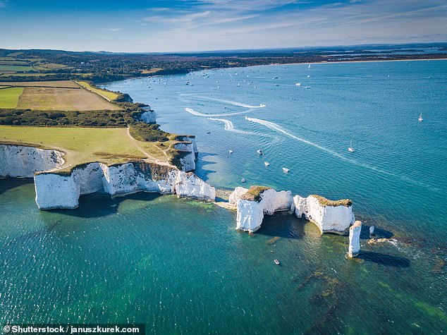 Surrounded by striking dunes and chalk cliffs, the bay is home to iconic chalk formations named Old Harry Rocks, which can be accessed by a 3.5-mile walk from South Beach
