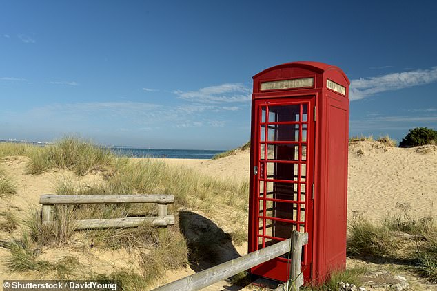 Pictured: Traditional red telephone kiosk near Studland Bay on Swanage Coast