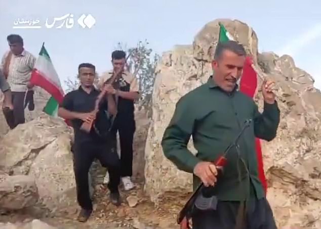 Following the crash, Iranian military forces put a $60,000 bounty on the airman's head, prompting Iranian militants to hunt for him in the mountains. (Pictured: Bakhtiari tribes in Khuzestan headed into the mountains, rifles in hand, searching for the missing American F-15 jet pilot)