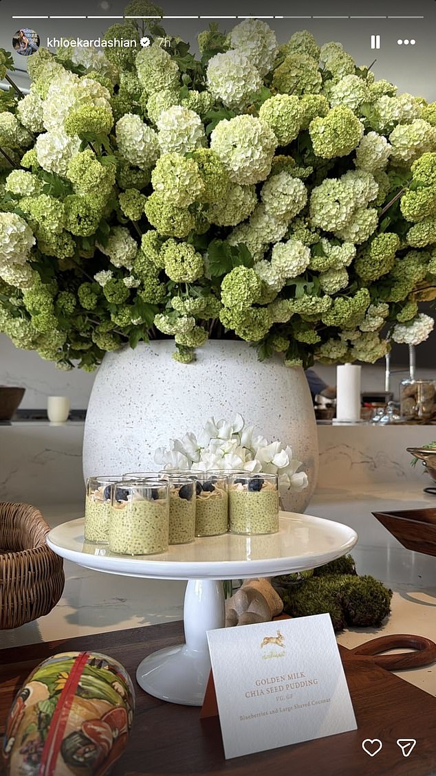 Khloé also snapped and posted a photo of a stunning floral arrangement placed behind a chia seed pudding station for them to enjoy