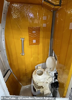 Pictured: A training mockup of the Artemis II toilet used to practice on Earth