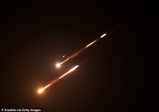 Missiles launched by Iran in retaliation for attacks by the United States and Israel are seen in the skies over Hebron, Palestine on April 6, 2026