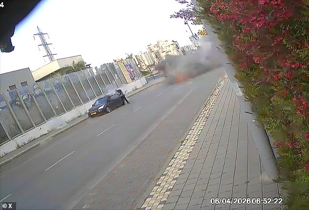 A large plume of smoke and dust rose through the air as the missile struck