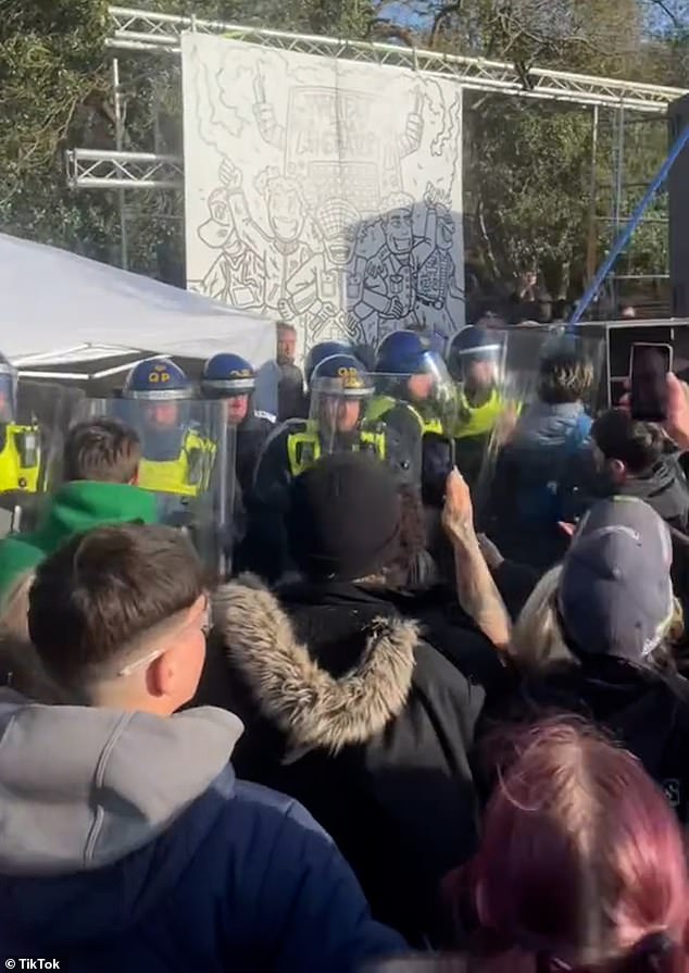 Footage posted on social media shows ravers grouping together to push against the wall of riot police holding up shields whilst a police helicopter hovered above