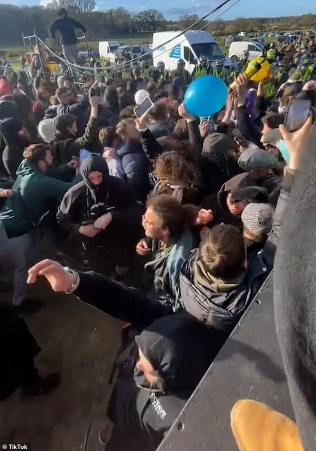 Other clips show attendees stumbling around as they inhaled 'hippy crack' from balloons and danced to the thumping music as police circled around