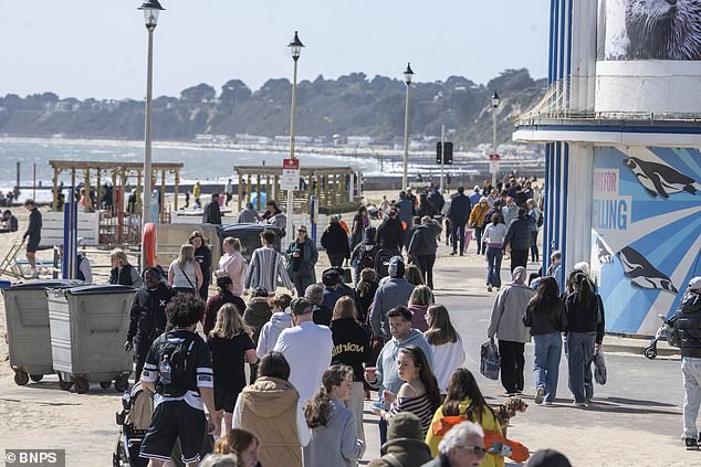 Crowds congregated down the beach of the affluent area, where beach huts can value close to the £500,000 mark