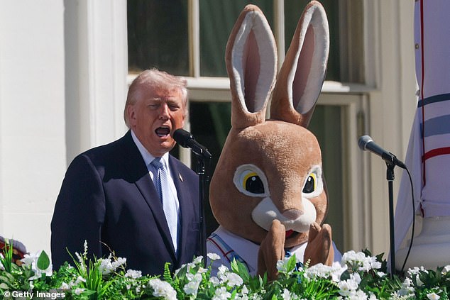 Trump speaks next to the Easter Bunny on the balcony of the White House during the Easter Egg Roll on the South Lawn