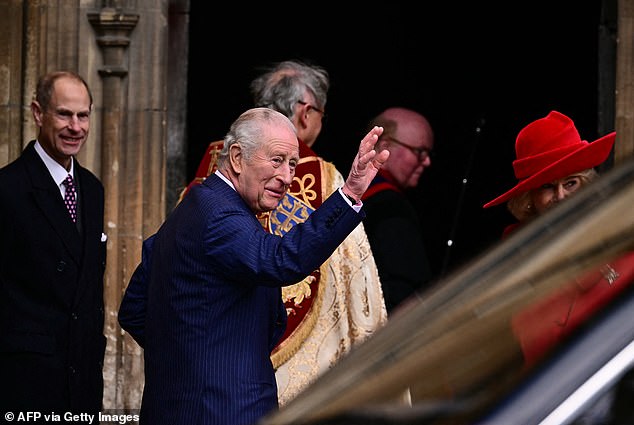 King Charles waves as he arrives with members of his family at St George's Chapel, in Windsor