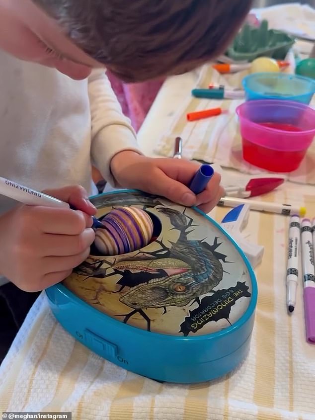 Archie is seen decorating an egg at Easter in the Duchess of Sussex's video