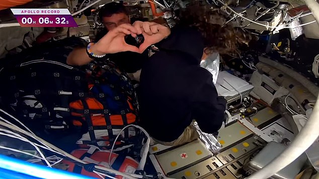 Reid Wiseman's family watched the historic moment unfold from the viewing gallery on the ground. When mission control told him his two daughters were smiling as they saw their dad on a big screen, the commander responded by forming his hands into a heart
