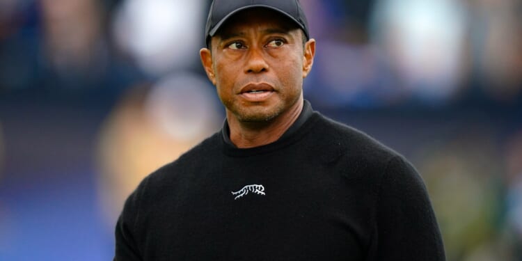 Golf star who Tiger Woods has blocked says he's 'pulling for him as a human being' after DUI arrest