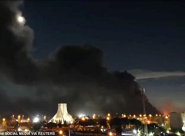 Smoke rises over Azadi (Freedom) Square following a strike, amid the US-Israeli conflict with Iran