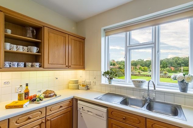 The modest kitchen which likely went unused as the holiday let offers guests a service where provisions can be booked to be at the house before arrival, with breakfast delivered each morning, or with all meals provided by the estate's 'private catering service'
