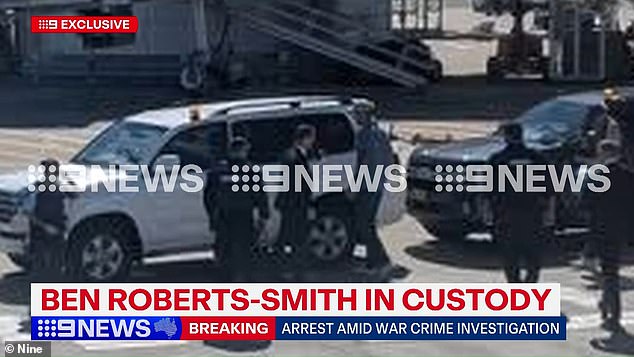 The officers were waiting at the arrivals gate as the plane touched down