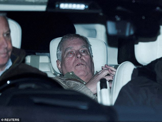 Andrew is seen slouched in the backseat of a Range Rover after spending 11 hours in police custody