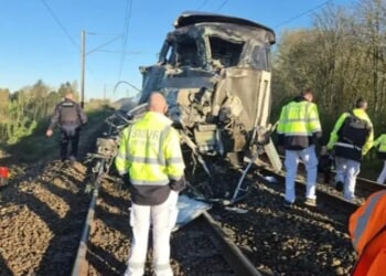 At least one dead and 27 injured after packed train carrying 250 people smashes into truck in horror rush hour crash
