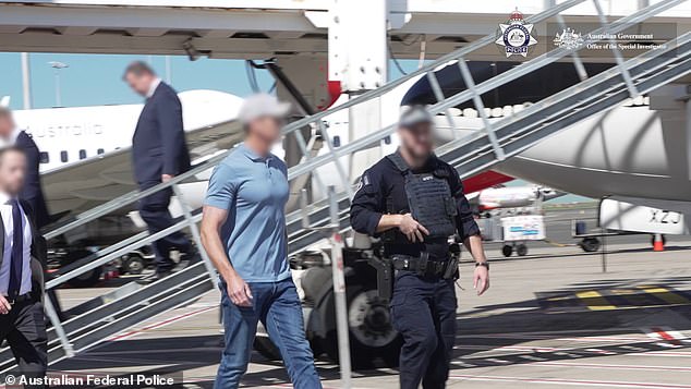 Footage captured Roberts-Smith being escorted away by AFP officers on the tarmac at Sydney Airport