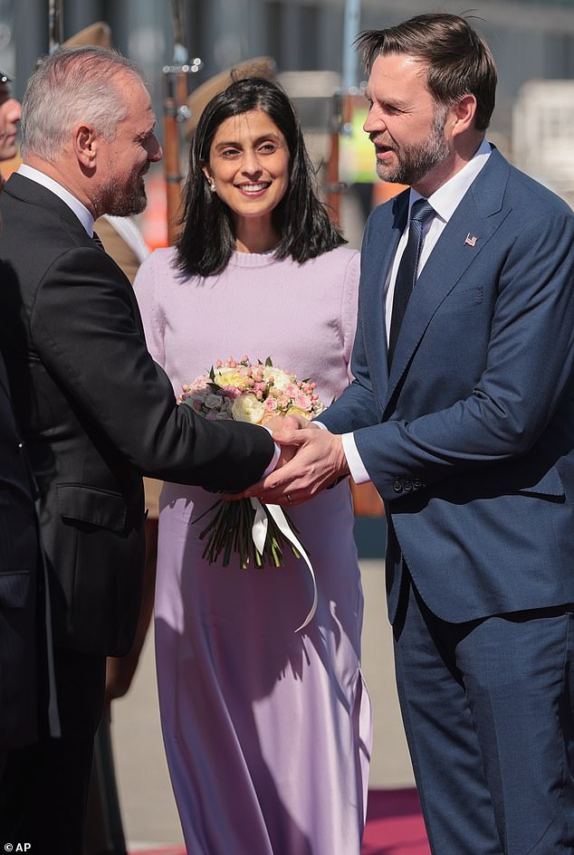 Usha wore a midi-length, purple satin skirt that appeared to be made by designer Veronica Beard, originally retailing for $448