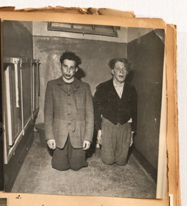 Two captured and beaten-up SS Nazi paramilitary officers