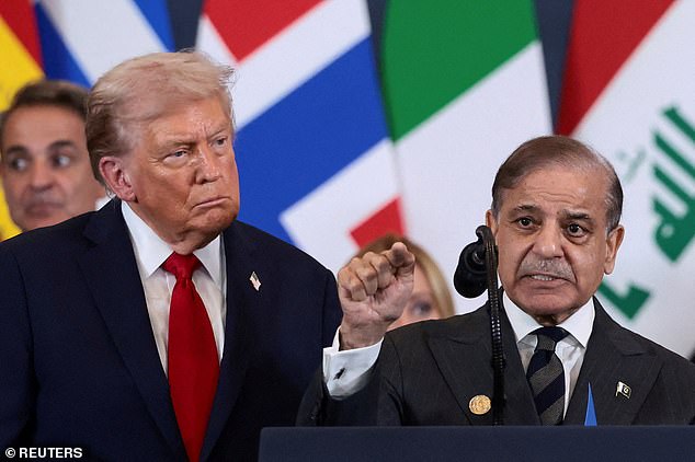 Trump looks at Pakistan's Prime Minister Shehbaz Sharif speaking following the official signing of the first phase of the Gaza ceasefire agreement between Israel and Hamas, during a world leaders' summit on ending the Gaza war, in Sharm El-Sheikh, Egypt, October 13, 2025