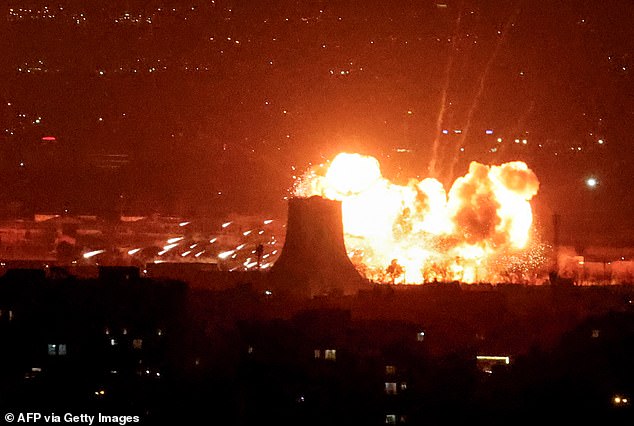 An explosion erupts following strikes near Azadi Tower close to Mehrabad International Airport in Tehran on March 7
