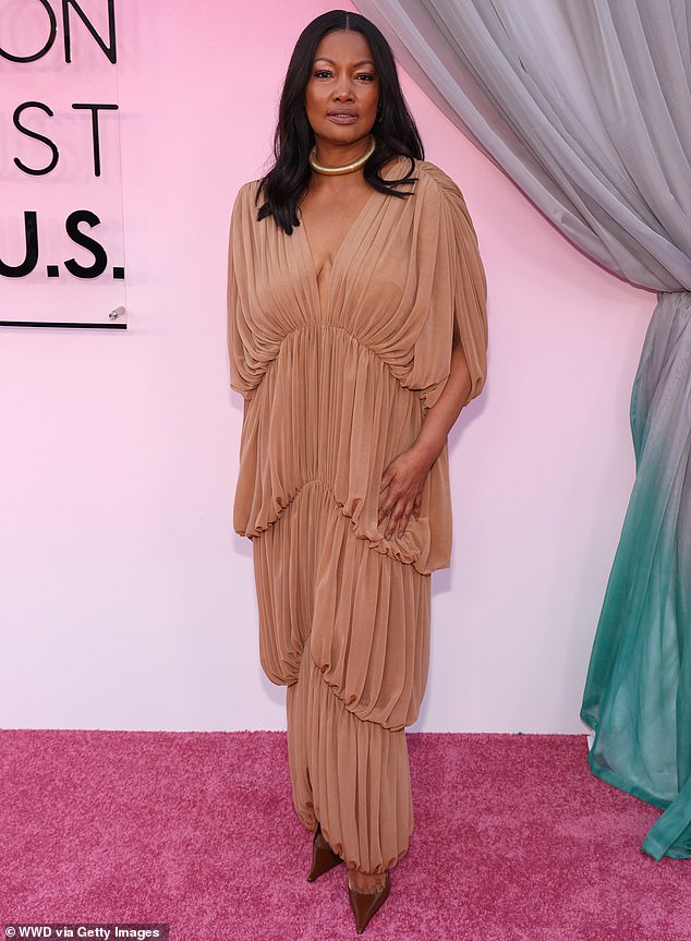Garcelle Beauvais, who was until recently one of The Real Housewives of Beverly Hills, modeled a flesh-toned finely pleated tiered ensemble