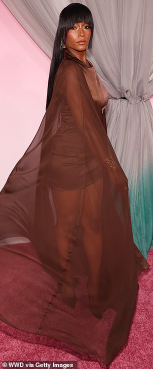 America's Next Top Model alum Yaya DaCosta twirled around to let her mesh cape flutter behind her