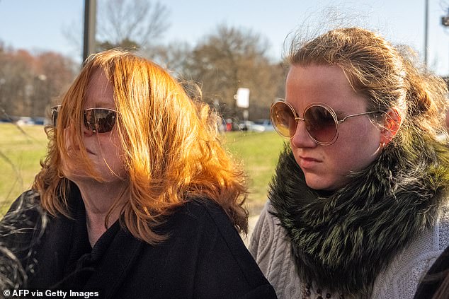 Asa Ellerup, the estranged wife of Rex Heuermann, and their daughter Victoria outside Suffolk County Court this morning ahead of the hearing