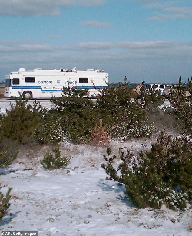 Suffolk County Police conduct a search on December 14, 2010 along Gilgo Beach where four bodies were found