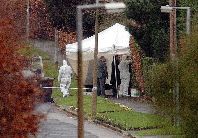 Officers said the arrest stemmed from the results of 'forensic materials' found by officers (Medical examiners are pictured at the home where Mr Luper died in Leeds)