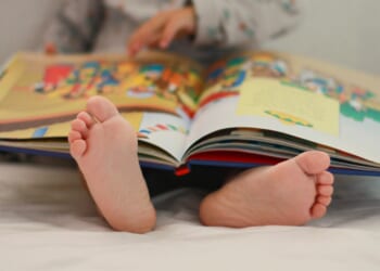 Kids trying to pinch and zoom on real PAGES like an iPad as parents fear books are becoming obsolete