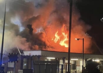 Huge fire breaks out at UK railway station in early hours as clouds of smoke fill sky and all trains cancelled