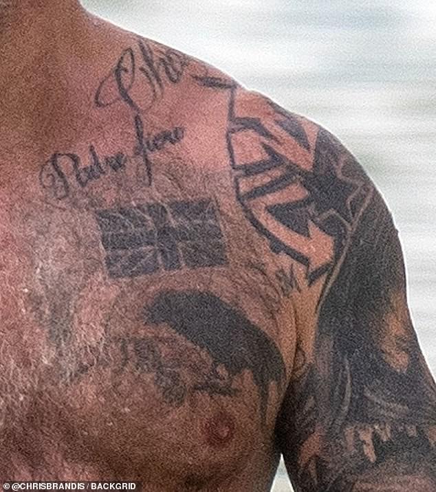 Visible on his torso were the words padre fiero, which means proud father in Italian, a Union Jack on his pec and the Marine Corps number of his best friend's father