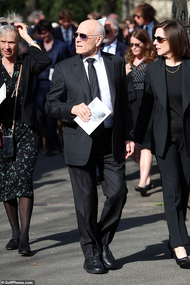 Frank Marshall wore a black suit and tie for the occasion