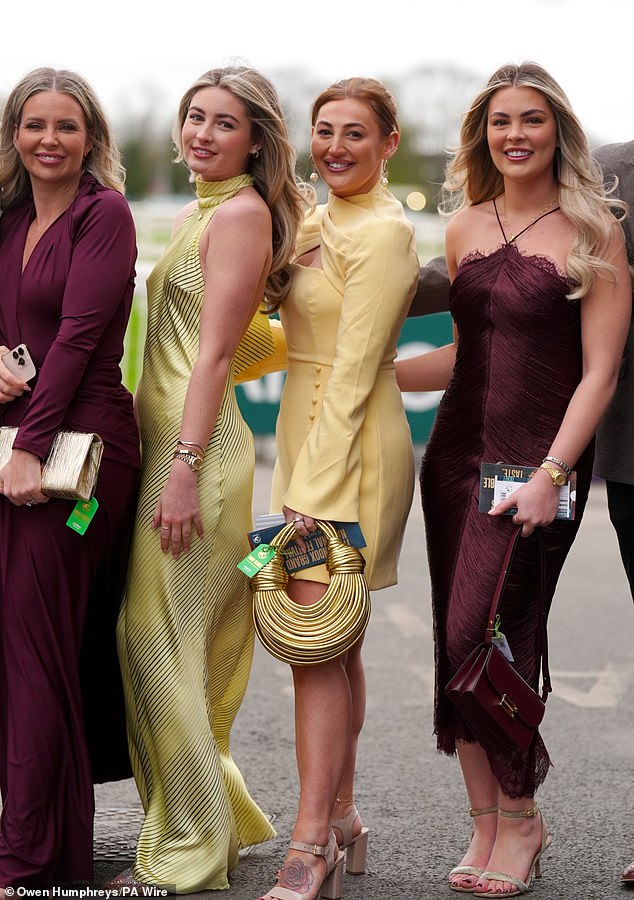 Bringing their A-game! A group of glamorous ladies showcase their figure-hugging ensembles as they wear matching shades of lemon and burgundy
