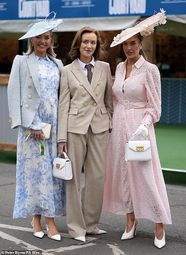 Effortlessly elegant: Racegoers put on a more classy display in maxi dresses and a cream suit