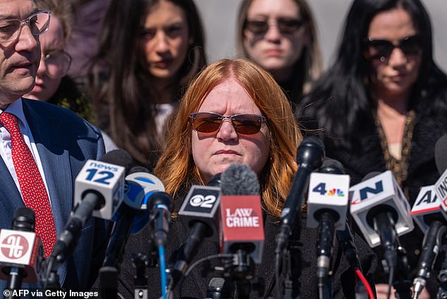 Asa Ellerup speaks outside court before quickly walking away, as a reporter shouts: ¿How did you not see what he was?¿