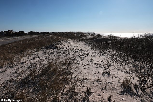 A stretch of beach stands empty at Gilgo Beach on April 8 2026, near where murder victims were discovered decades ago