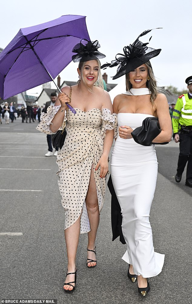 No raining on their parade! Glamorous Aintree racegoers refused to let the rain dampen their spirits as they attended the first day of the Grand National festival yesterday