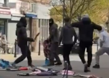 Terrifying moment hooded yobs slash machetes at each other in town centre as bystanders left horrified & cops scramble