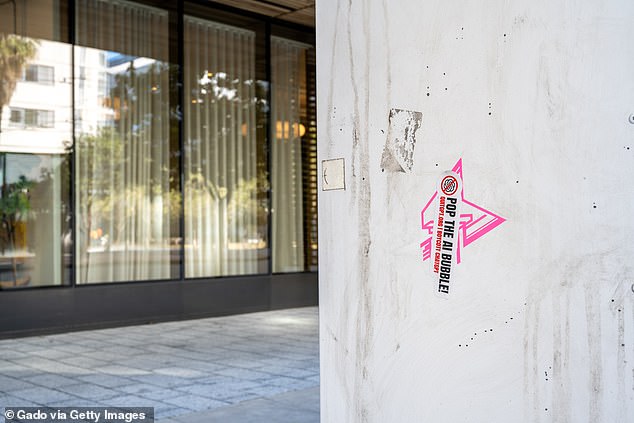 A suspect was later named as Alejandro Daniel Moreno-Gama. A booking photo was not immediately available. It's unclear what the suspect's motive was. An anti-AI sticker in front of OpenAI's headquarters is pictured above