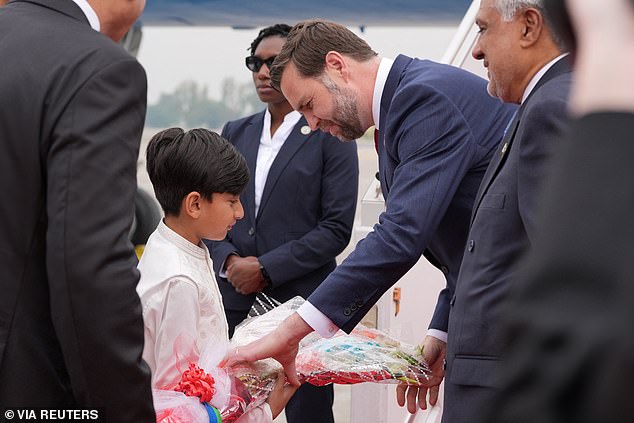 U.S. Vice President JD Vance receives a bouquet of flowers after arriving for talks with Iranian officials in Islamabad, Pakistan, Saturday, April 11