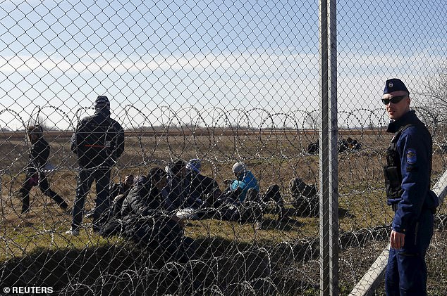 Stern-looking armed guards drove patrol cars up and down a track beside it. Migrants have no choice but to turn around