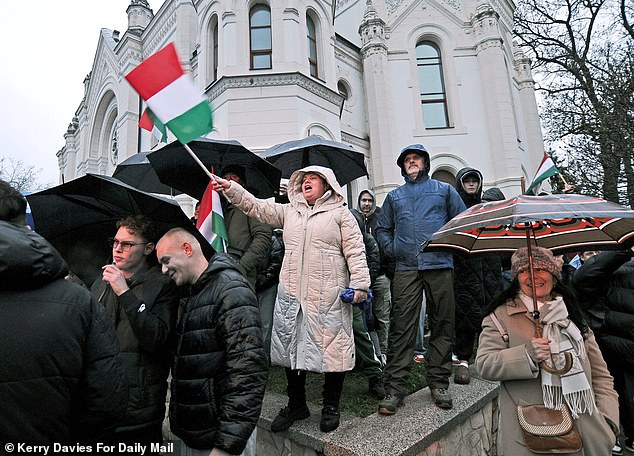 Supporters of Prime Minister of Hungary Viktor Orban at a rally on Monday March 30, 2026 during a very rainy day in the town of Szolnok