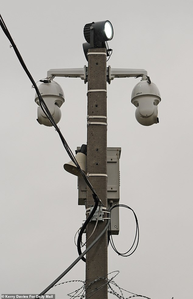 It seems Hungary has found a simple way to solve the problem cursing the rest of Europe. Pictured: Security cameras at the fence