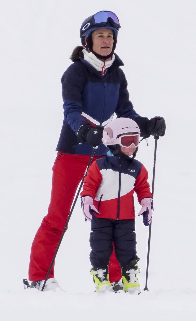 The girls were almost identically dressed in black ski trousers and red and white jackets with protective white helmets and wearing goggles